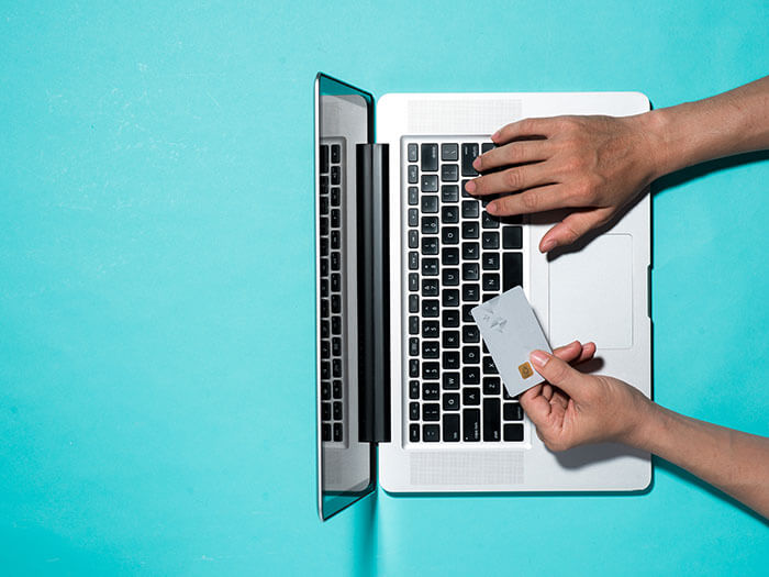 Top view of male hands making online payment Global Payments Report