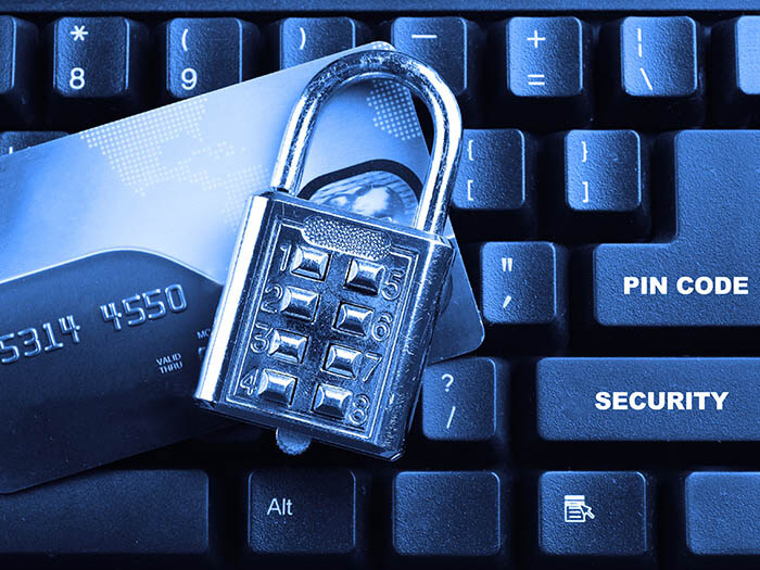 security lock on credit cards with computer keyboard Online Thanksgiving Fraud