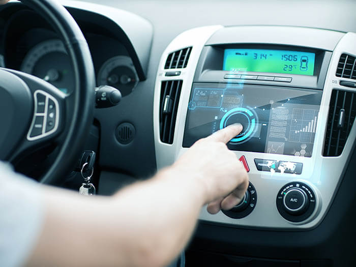 man using car control panel General Motors Online Shopping