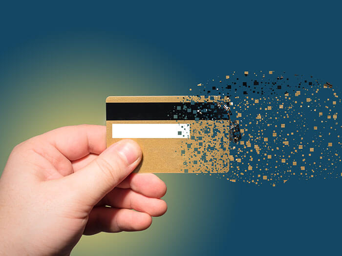 hand holding credit card which is sprayed APAC online shoppers